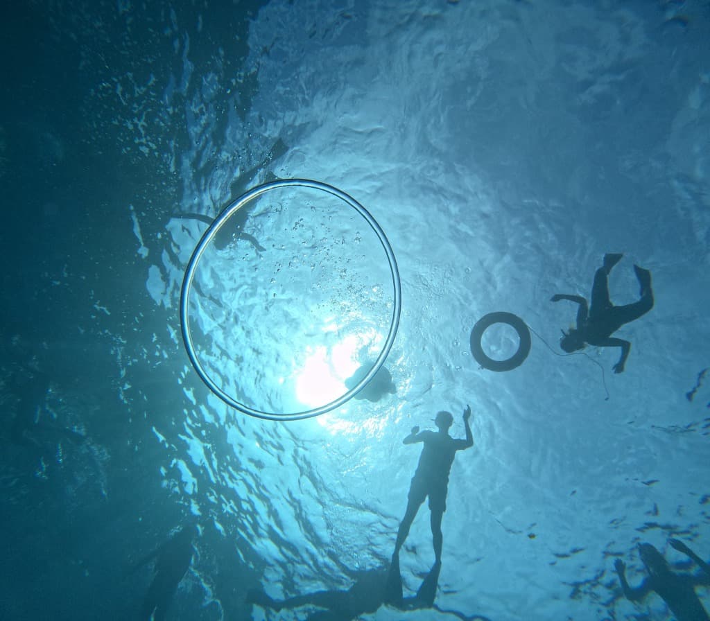 Blowing bubbles with dive friends underwater in Nusa Penida.