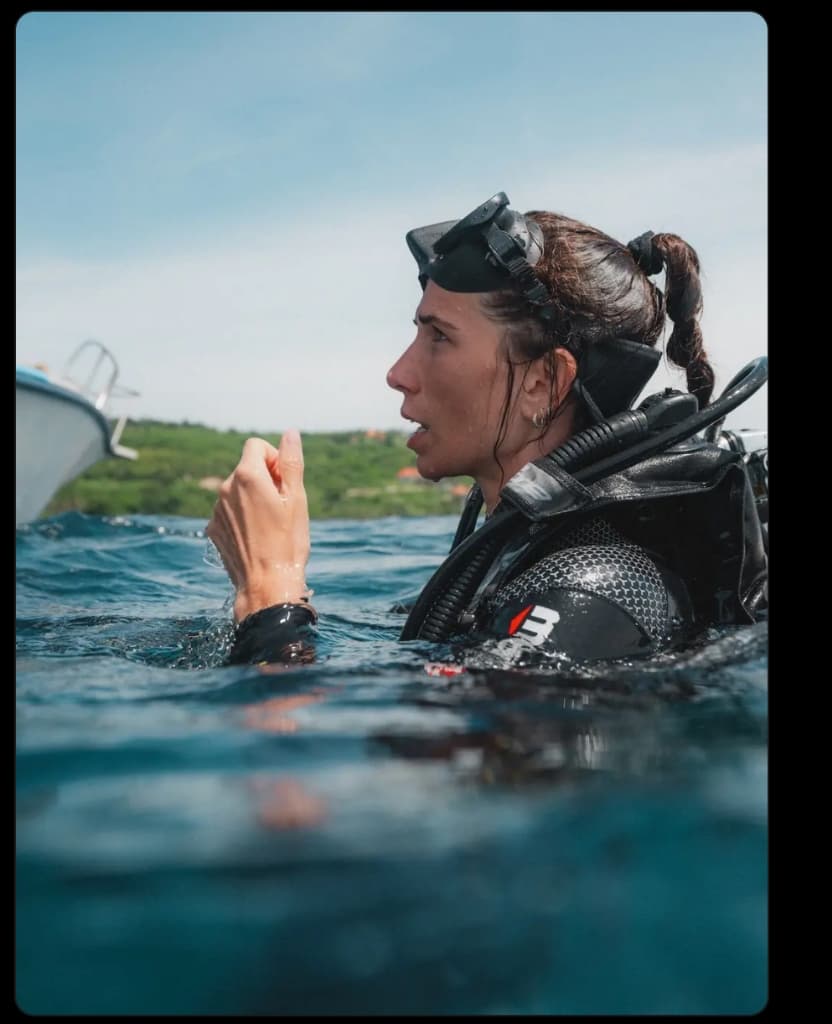 Project Laut instructor assessing conditions from the water