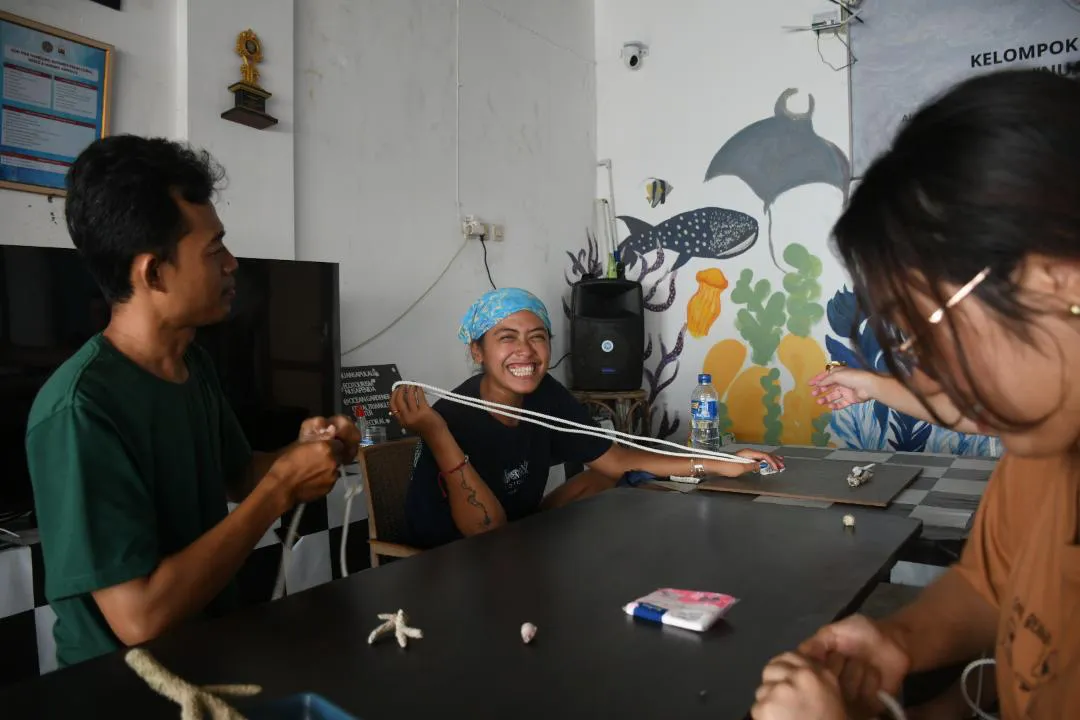 Guests learning coral preparation techniques with the team