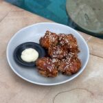 Crispy chicken tenders coated in Korean BBQ sauce with sesame seeds and kewpie mayo at The Penida Project in Nusa Penida