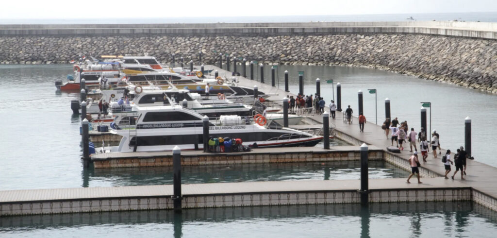 Fast boats boarding passengers at Sanur Harbour in Bali departing to Nusa Penida