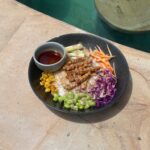 Tempe poke bowl with rice, edamame, corn, cabbage, sesame mayo and ponzu sauce at The Penida Project in Nusa Penida